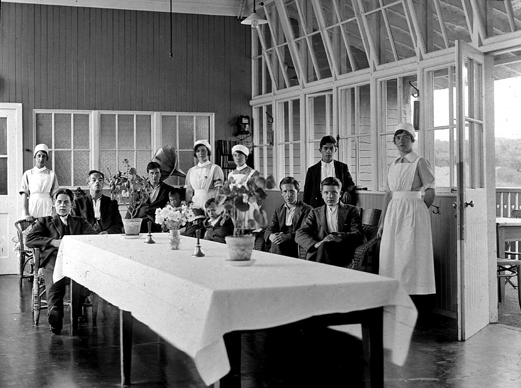 Workers at the City Hospital, around a table