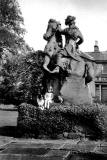 Morag Stewart5 and dog, Lassie, sitting on the statue in front of Clermiston House, in the early-1960s