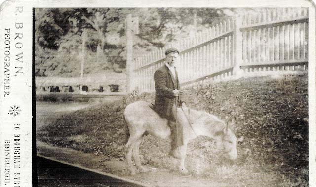 Edinburgh professional photographer, Robert Brown, on a donkey in his father's studio in Aberdour