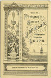 The back of a Cabinet Print by John McKean  -  Man and dog