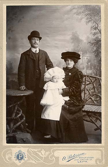 A cabinet print from the studio of A Paterson, Leith  -  A couple and a baby