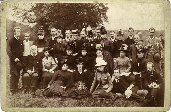 Cabinet print of a group of adults with a viaduct in the background