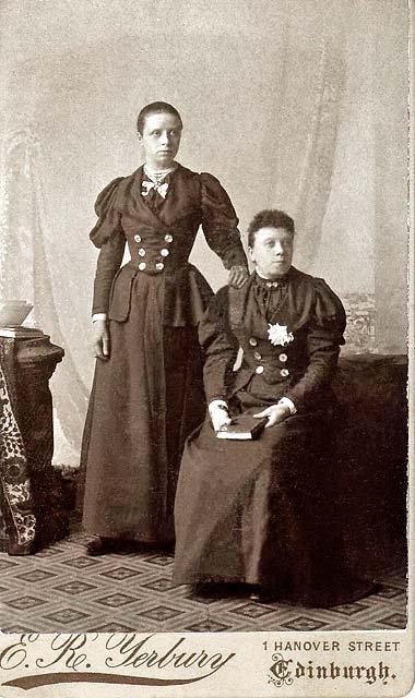 Yerbury Cabinet Print  -  Two ladies in matching outfits