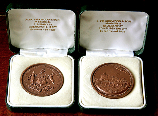 Single sided EPS Medals awarded for the Advanced Section of the Monthly Slide Competition, Seasons 1993-94 and 1995-96.  These Medals are in their Kirkwood & Son Cases.