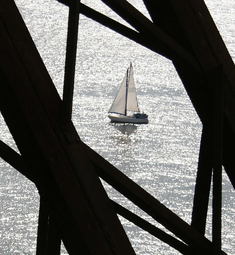 Looking down from the Forth Bridge  -  A yacht close to South Queensferry.