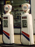 Zoom-in to two pumps on the left at a Fina garage in the Scottish Highlands