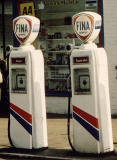 Zoom-in to two pumps on the left at a Fina garage in the Scottish Highlands