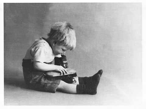 Photograph by AH MacLucas of his son Norman - Boot Cleaner