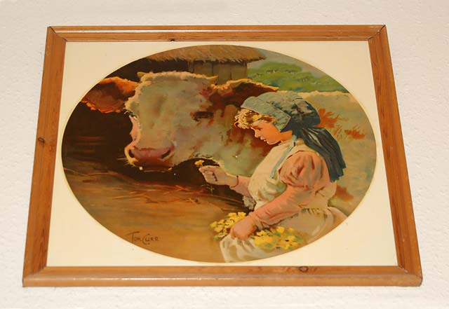 Painting by Tom Curr  -  girl and brown cow  -  probably uses as the basis for tiles on Buttercup Dairy Co shops