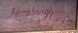 The signature on the bottom corner of a painting by John Horsburgh  -  A boy holding a model yacht