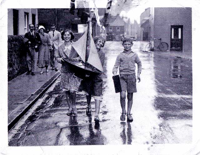 Photographs by K F Balmain  -  Three children in North Berwick and a model yacht