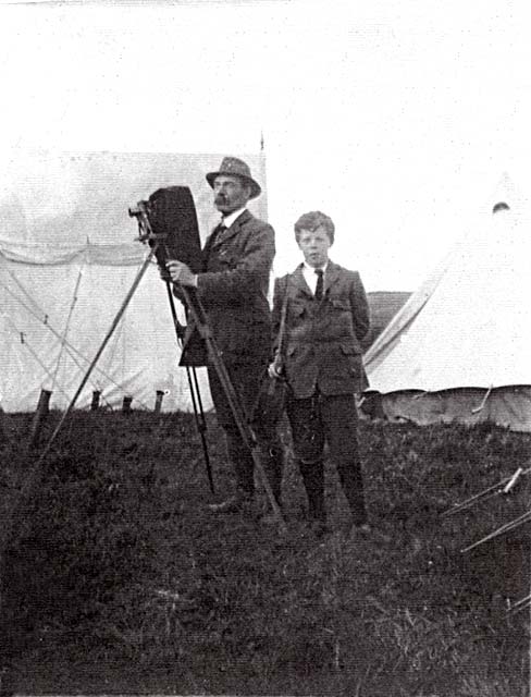 Ediinburgh Professional Photographers  -  John Drummond at military camp with his camera and his son, Ian