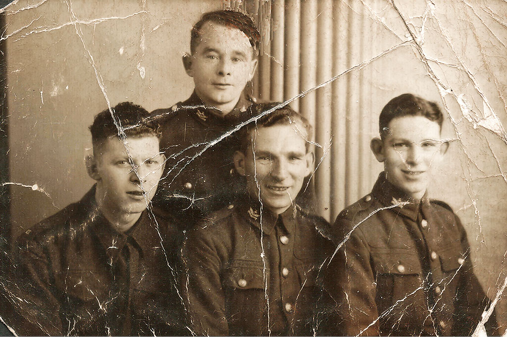 Four  brothers, all members of the Scots Guards, taken at Jerome's Studio, 79 Leith Street, in 1939