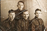 Four  brothers, all members of the Scots Guards, taken at Jerome's Studio, 79 Leith Street, in 1939