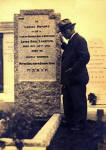 The gravestone of the photographer Louis Saul Langfier, with his brother Adolph standing beside it.