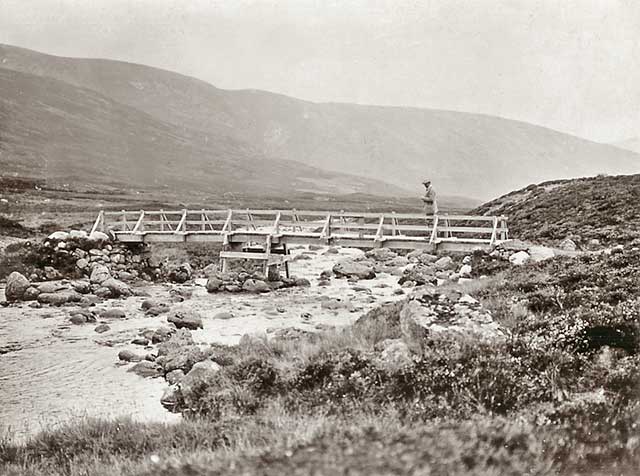 Photograph from the family of Horatio Ross  -  Hunting and Shooting in the Scottish Highlands  -  Crossing the wooden bridge