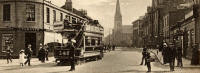 Zoom-in on a postcard by J K Home Crawford Gravure Series  -  Looking along Portobello High Street from its junction with Bath Street