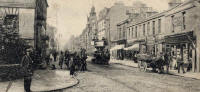 Zoom-in on a postcard by J K Home Crawford  -  Looking along Portobello High Street from its junction with Brighton Place