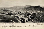 A postcard by Hartmann  -  A black & white view of Arthur Seat and Salisbury Crags from Calton Hill
