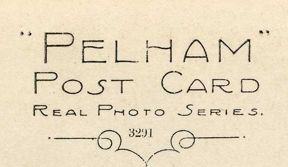 Zoom-in to the back of a postcard published by Pelham - St Anthony's Chapel in Holyrood Park