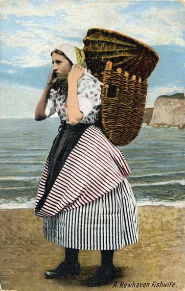 A Newhaven Fishwife, with sea cliffs in the background  -  A  Valentine postcard in colour