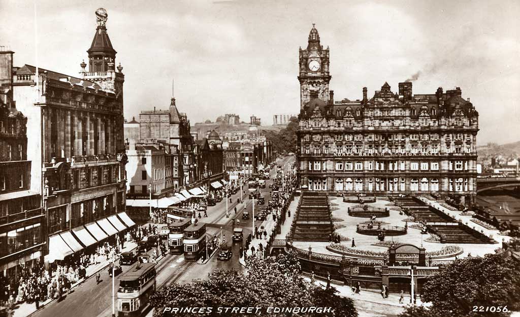 Postcard in the "Best of All" series by J B White Ltd, Dundee  -  Princes Street looking east towards the North British Hotel  -  framed by a Buchanan tartan