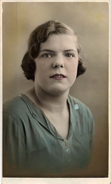 Hand-tinted postcard portrait of Rosina Spencer, from one of Jerome's studios  