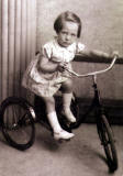 Photo taken in Jerome Studio, Leith Street, Edinburgh  -  Ellen Davie on a tricycle, around 1939-40