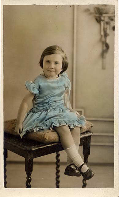 Hand-tinted postcard portrait of a girl from one of Jerome's studios  