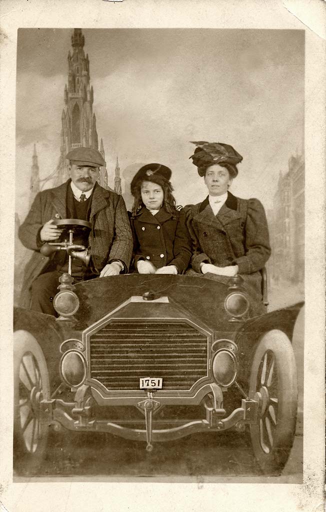 Postcard portrait with a studio car and backdrop by Claude Low