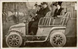 Portrait of three in a studio car.  Who was the photographer?