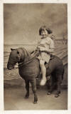 Photo from the Portobello studio of Robert McLelland - Postcard portrait with a stuffed donkey, around 1935