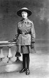 Postcard Portrait from the studio of Alec Roberts, Piershill, Edinburgh  -  Allan Dodds' mother, photographed in girl guide uniform, around 1921