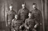 A Photograph of two brothers from Leith with whippets  -  taken in an unidentified studio