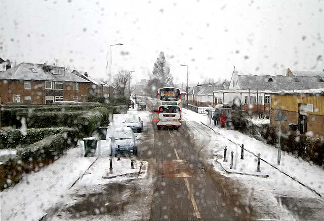 Looking to the west along Boswall Parkway in the snow, from the top deck of a No 19 bus