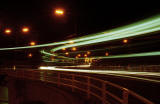 Roundabout at the junction of Calder road and Broomhouse Road  -  Close-up of traffic trails at night