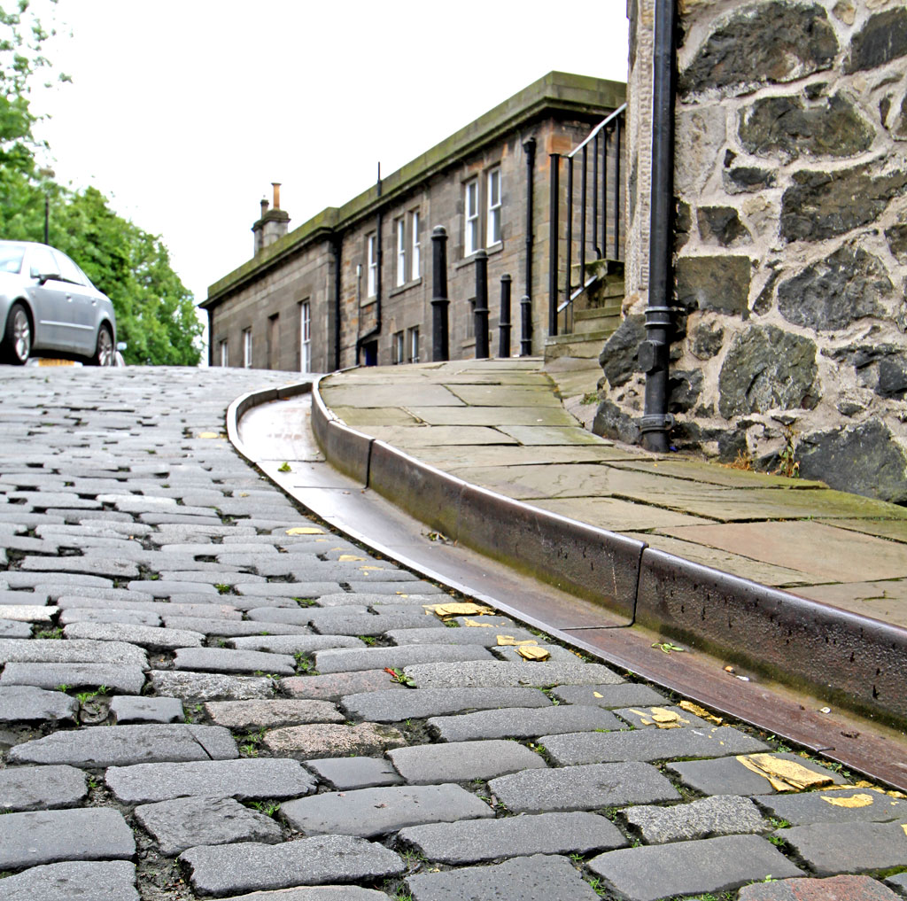 Metal Gutter and Drain at the edge of Calton Hill, the steep street leading up from Leith Street to Regent Road