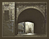 Looking to the west along Cowgate, and through one of the arches of South Bridge, towards the Grassmarket, around 1970