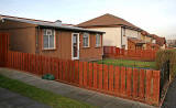 Looking south up Craigour Avenue, including one of the prefab houses