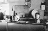 Bathtime:  Leanna Weeks  + John Morton at their prefab, 5 Craigour Avenue  -  Photo taken August 1950