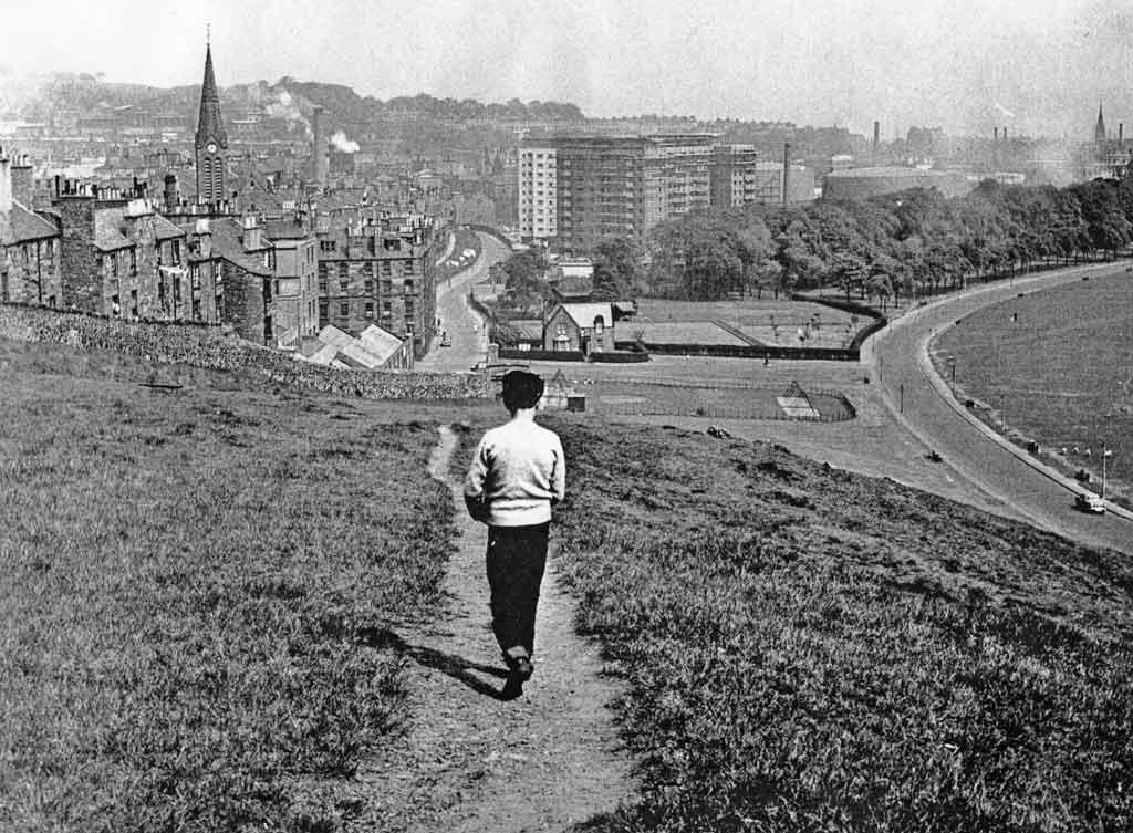 Looking down on Dumbiedykes from a path through Holyrood Park leading from James Clark's School