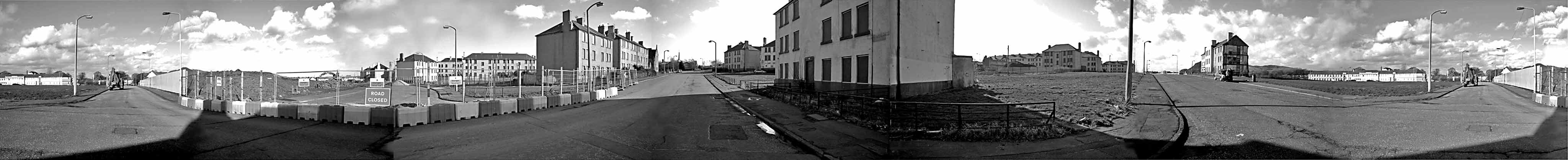 Monochrome panoramic view of Craigmillar from Niddrie Mains Drive - as the building of the new school commences