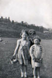 Gordon, Margaret and Linda in Holyrood Park with Dumbiedykes in the background, around 1953