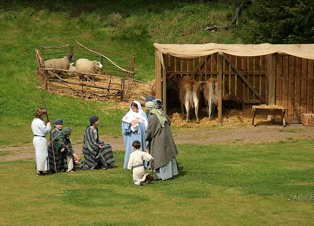 A scene from 'The Life of Jesus Christ' - a play presented at Dundas Castle  -  Mary, Joseph and Jesus with the shepherds outside the stable
