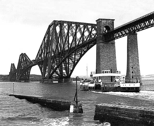 The ferry, Queen Margaret, approaches Hawes Pier at Queensferry with the Forth Bridge in the background