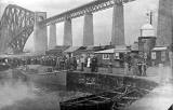 Crowd on the pier beside the Forth Bridge at South Queensferry