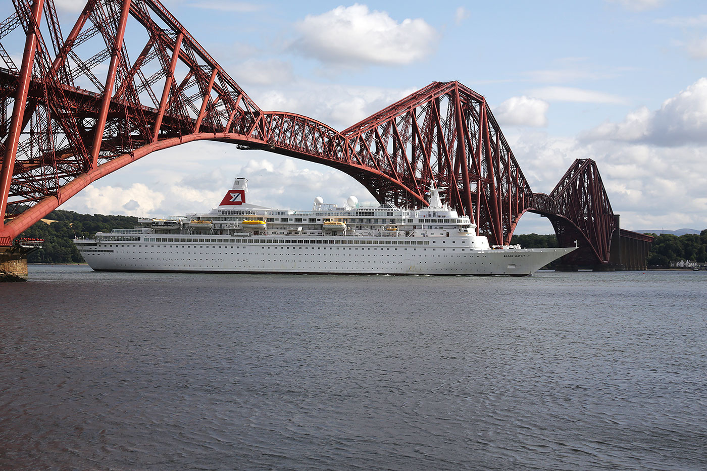 Crruise Liner, 'Black Watch' passes under the Forth Bridge on her way to dock at Rosyth