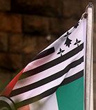 Corner of a flag flying from a flagpole below the Forth Bridge at North Queensferry.  Is this corner of the flag the 'Flag of Brittany'?