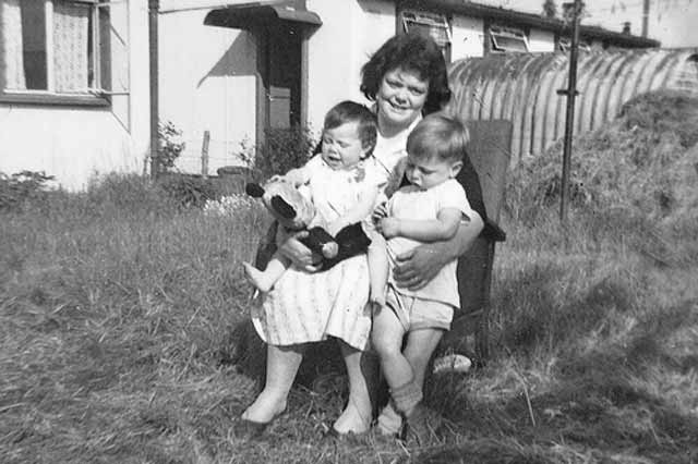 Photograph taken outside one of the pre-fab houses at Greendykes