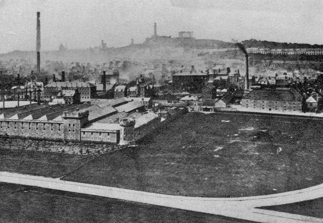 Looking down on Holyrood.  When might this photo have been taken, and what is the tall chimney on the left?